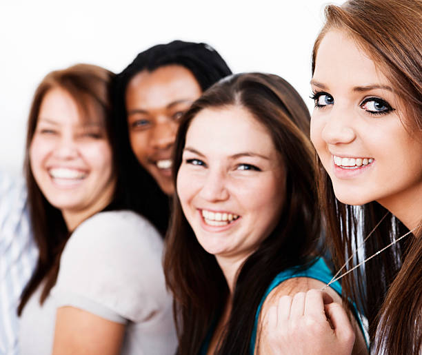 istock Three pretty girls and one cute guy smile together 183327765