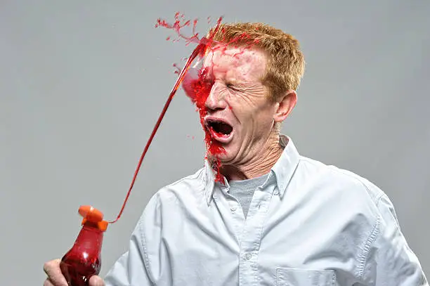 Man squirted in face by liquid from ketchup bottle