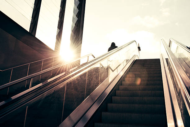 istock Business man on the escalator 183327913