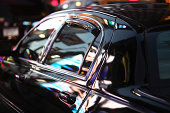 Neon Nightlife Reflected In Limo Window