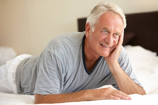 istock Senior Man Relaxing On Bed 183328317