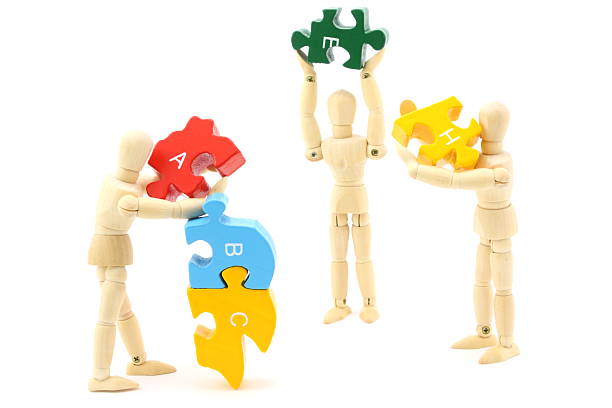 teamwork (teamarbeit) - figurine puzzle people business stock-fotos und bilder
