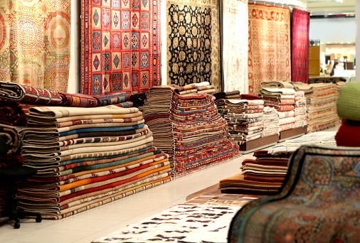 colorful collection of carpets and rugs folded and displayed..More in the Arabia Related lightbox..