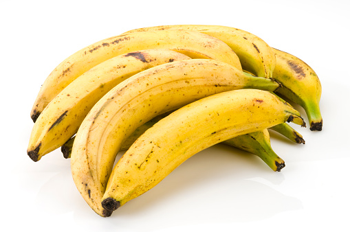 Yellow Plantains on White Background.  Note that they were not retouched to retain it's original apparence.