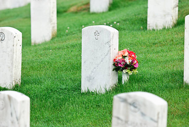 istock tombstone with flowers 183329299
