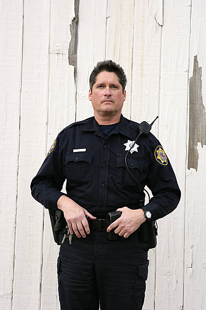 istock Police Officer Looking at Camera Three Quarter Length 183329539