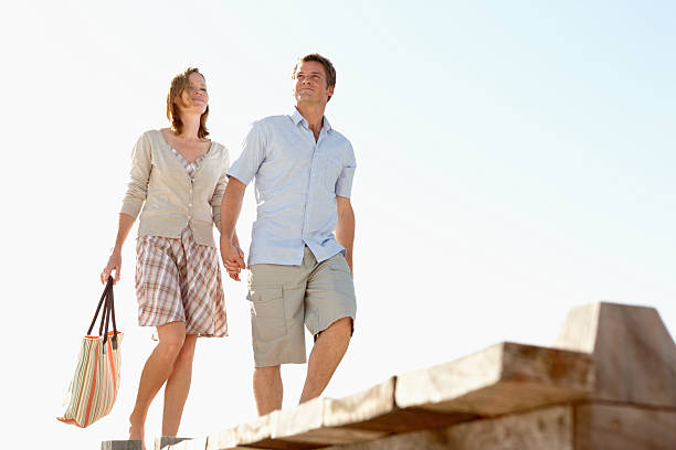 istock Romantic middle aged couple taking a walk outdoors 183329857