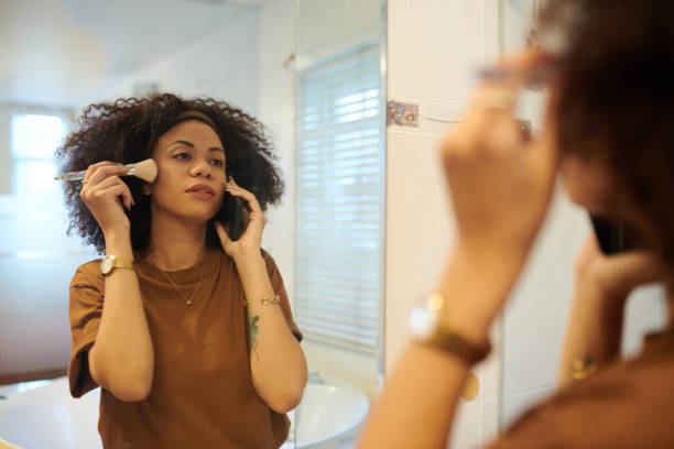 istock Woman Talking on Phone and Applying Makeup 1833301449
