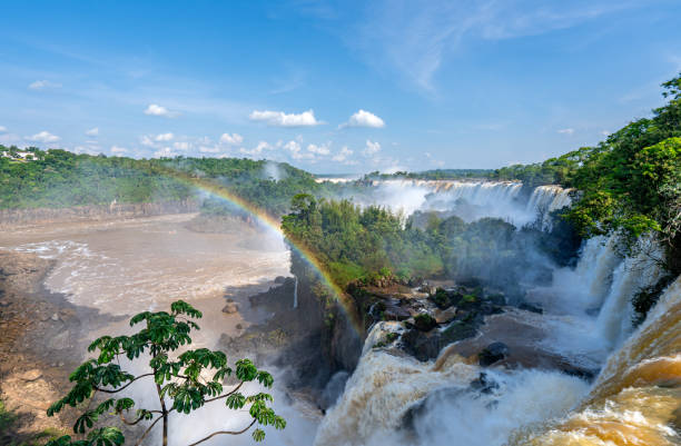 Rainbow and the Breathtaking Mighty Iguazu Falls in Iguazu National Park on the Boarder of Argentina and Brazil, South America Rainbow and the breathtaking mighty Iguazu Falls in Iguazu National Park on the Boarder of Argentina and Brazil, South America misiones province stock pictures, royalty-free photos & images