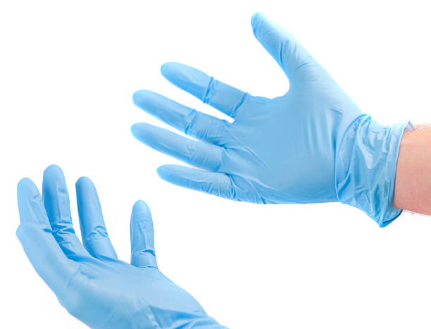 préparez-vous pour le soin des mains de médecins hygiénique de gants bleus - antibakteriell photos et images de collection