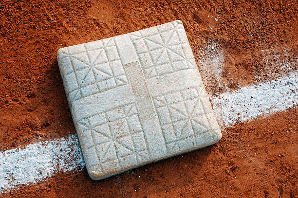 Close-up view of a baseball base on the field stock photo