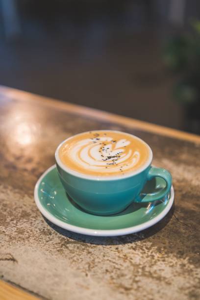 istock Delicious Salted Bourbon Carmel Latte served on a blue plate 1833309776