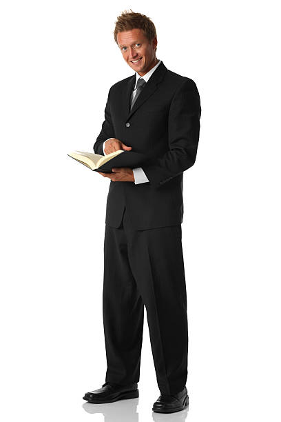 istock Businessman holding a book 183331388
