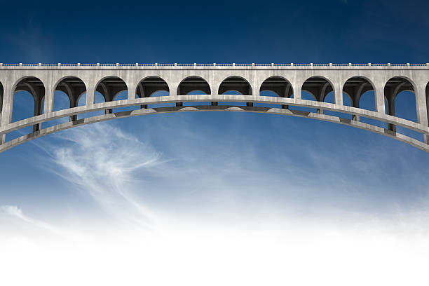 bridging the gap Low angle view of a concrete bridge with blue sky background. This image contain copy space for your image or message.Could be useful in a bridge metaphor composition.This is a detailed 3d rendering. bridging the gap stock pictures, royalty-free photos & images