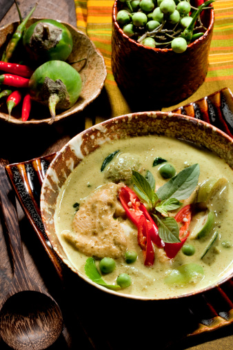 Thai Green Curry With Chicken & Fresh Ingredients As Garnishing.