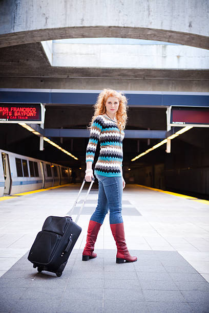 istock Girl with a Suitcase on Train Platform 183332758