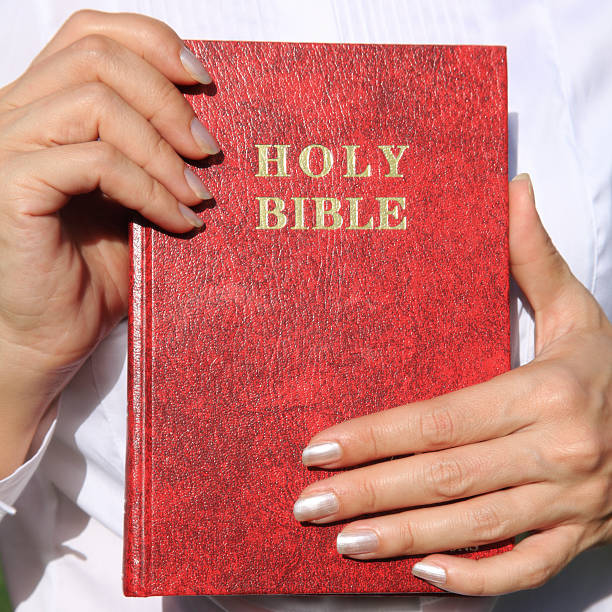 istock woman showing Bible 183333422