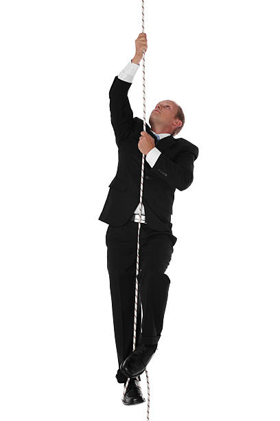istock Businessman climbing rope 183333651
