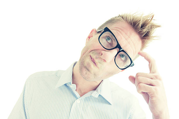 istock Young Man in Glasses Thinking and Scratching Head White Background 183333719