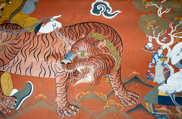 A wall painting, representing a tiger,  at the Paro Monastery in Bhutan.  Religious Paintings and statues ore in the public domain.  Bhutanese art is anonymous, religious and as a result it has no aesthetic function by itself. A Bhutanese does not view a painting or a statue as a work of art but as a religious work.  Paintings are not signed, paintings have no copyright.  This is all well explained in Françoise Pommaret’s “Bhutan, Himalayan Mountain Kingdom” edited by Odyssey Books &  guides.