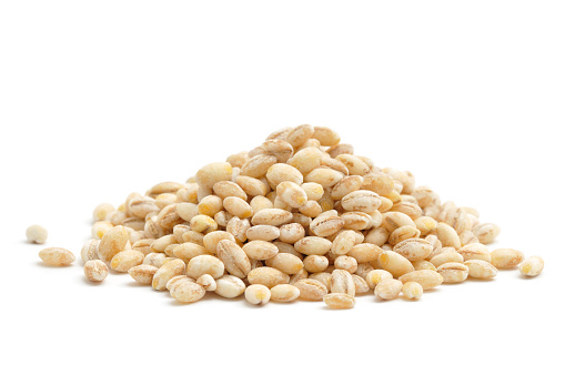 A small pile of Pearl Barley isolated on a white background.