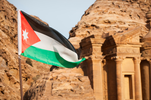 Flag of Jordan flying at the monastery in Petra, Jordan