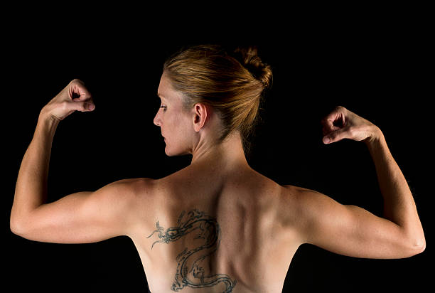 istock Strong forty something woman flexing 183336564