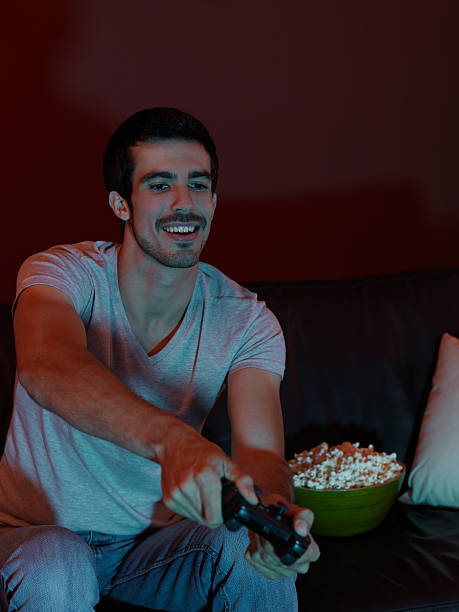 istock Young man enjoying playing video games 183336585