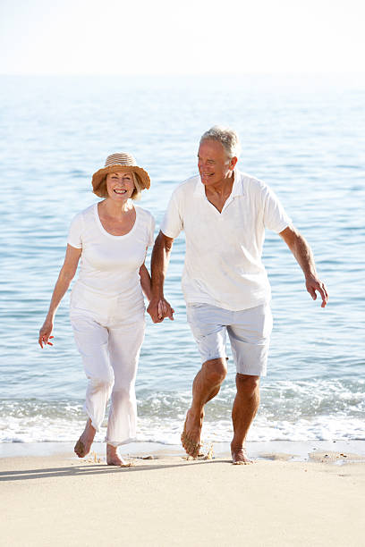 istock Senior Couple Enjoying Beach Holiday 183336663