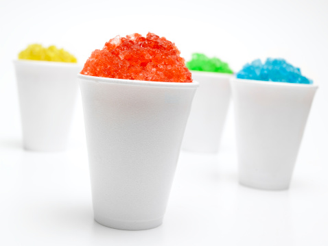 four different snow cone flavour's isolated on white