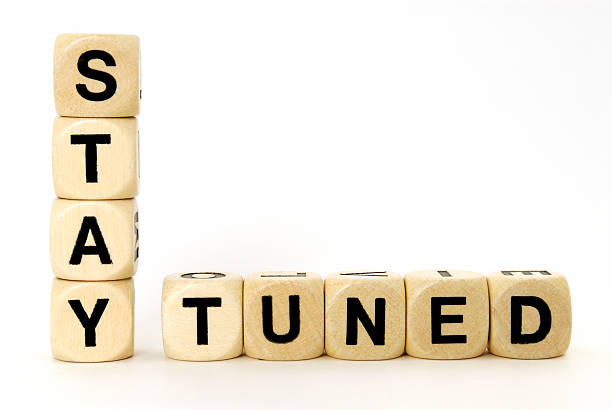 stay tuned "some wooden dice build the words stay tunedletters, words and dice" stay tuned concept stock pictures, royalty-free photos & images