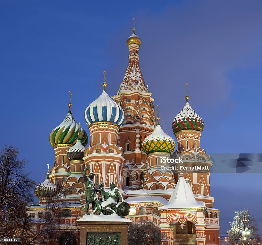 Moscow. St.Basil Cathedral, Minin and Pozharskiy monument in the evening. St. Basil church is a Russian Orthodox cathedral erected on the Red Square in Moscow. Minin & Pozharskiy monument. There is in central of Moscow.Nobody.Winter. Architecture Stock Photo