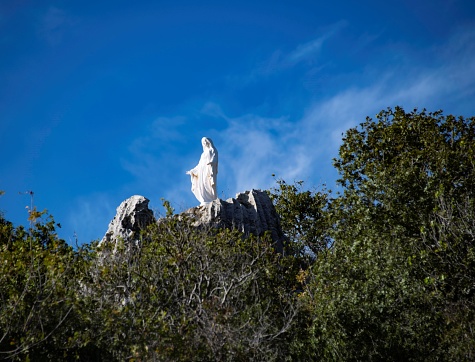 Mar Chaaya, Lebanon - 11 30 2023: Virgin Mary statue on top of a mountain near the Mar Chaaya monastery in Lebanon surrounded by Pine forest