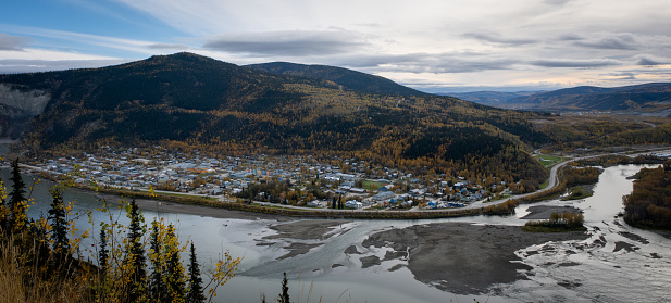 An autumn view of Dawson City,the midnight dome,and the confluence of the Yukon River and Klondike River from a viewpoint on Sunnydale Road on the north side of the Yukon River