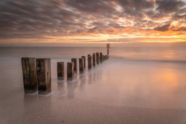 istock Coastal Groynes at Sunrise 1833381632