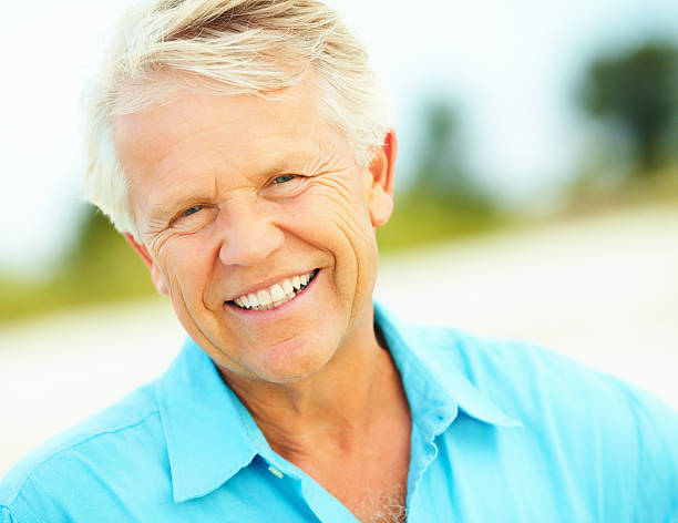 istock Portrait of retired man smiling 183338271