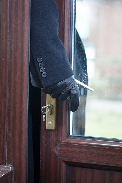 istock Opportunist thief opening patio door 183338307