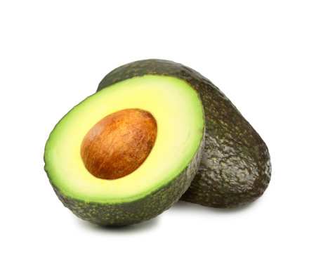 Ripe avocado fruit holding by hand ready to eating, Tropical fruit