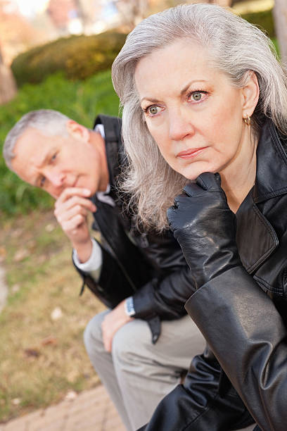 istock Woman Looking Away While Partner Curiously Looks at Her 183338464