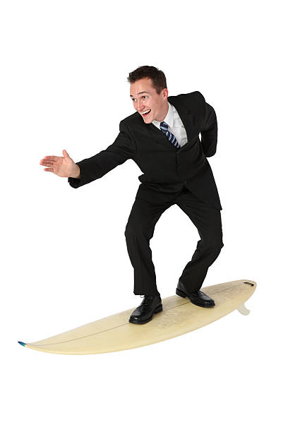 istock Isolated young businessman surfing in his suit 183338535
