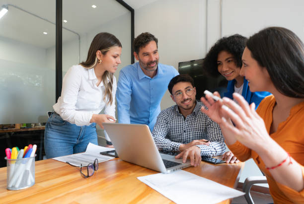 istock Group of business people sharing ideas at the office 1833393139