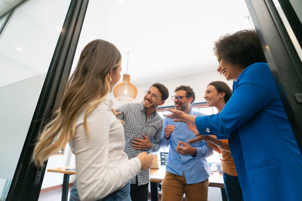 istock Group of coworkers having fun while taking a break at the office 1833393160