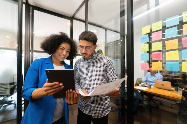 istock Business team working together at the office using a digital tablet 1833393693