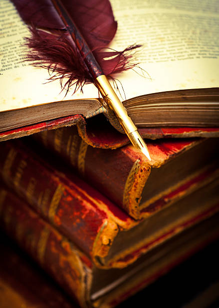 istock Quill pen on books 183339375
