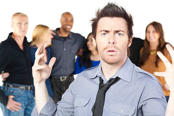 istock Young Man With His Hands Up In Front of People 183340125