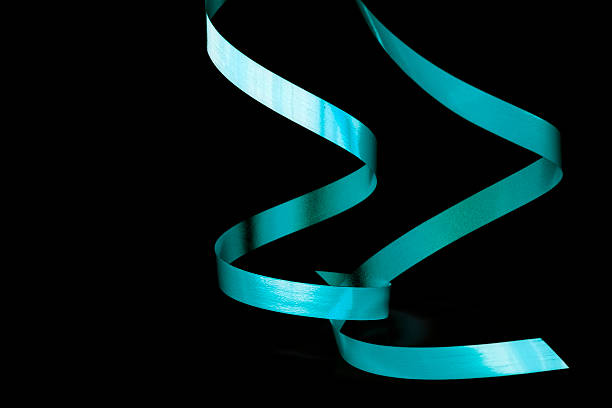 two green ribbons isolated on black stock photo