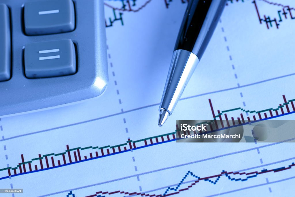 charts charts whit calculator Analyzing Stock Photo