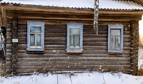 istock Frozen windows of an abandoned house. 1833407392