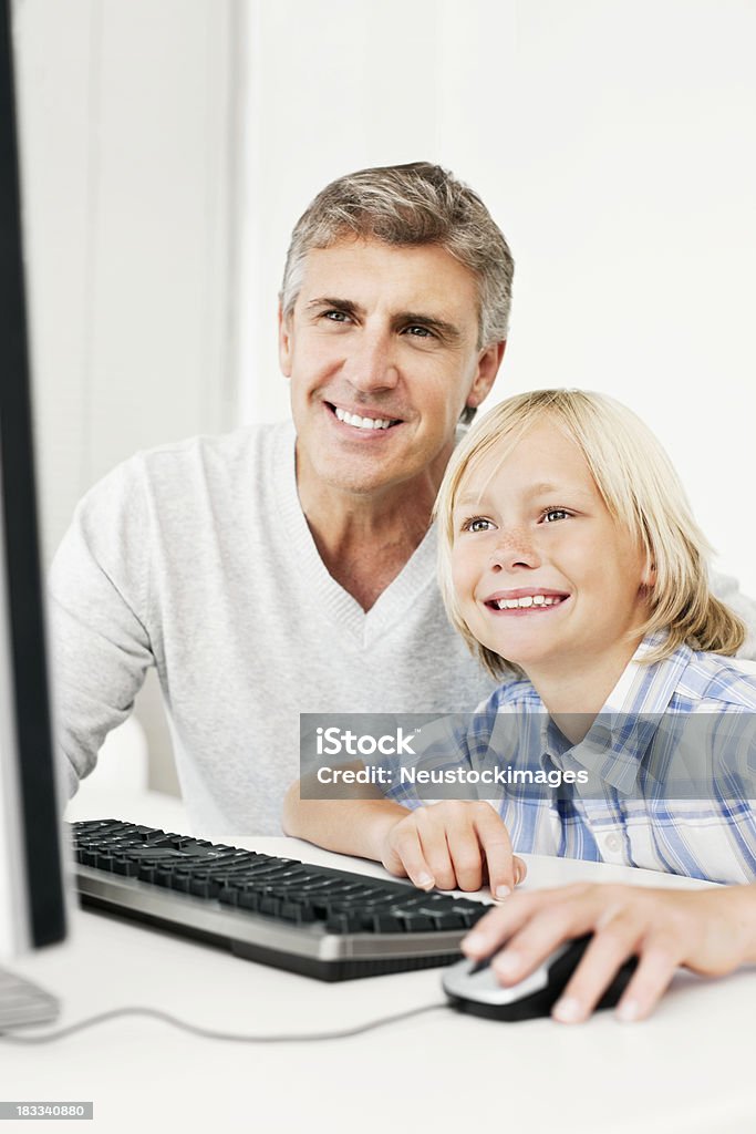 Computer In Father Father And Son Using The Computer Stock Photo - Download Image Now - 40 ...