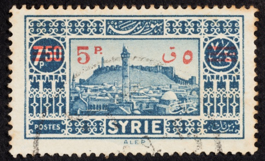 Syrian postage stamp isolated on black